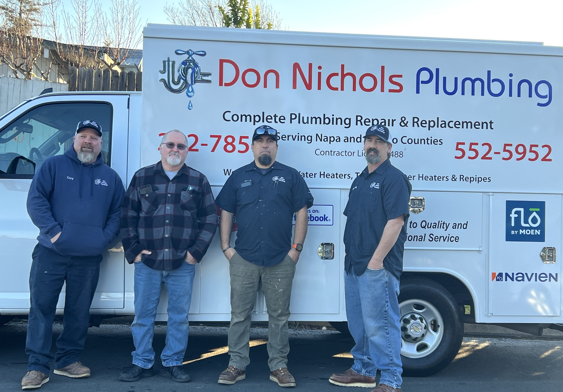 4 men standing in front of don nichols plumbing truck